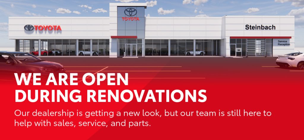 Exterior of Steinbach Toyota dealership with message announcing business is open during renovations.